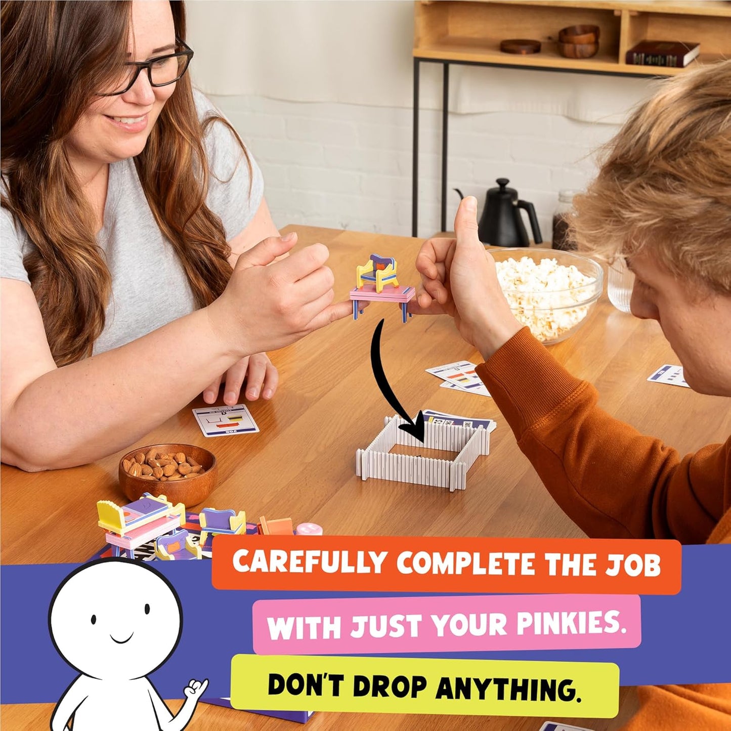 Exploding Kittens Presents: Giants Moving Tiny Furniture